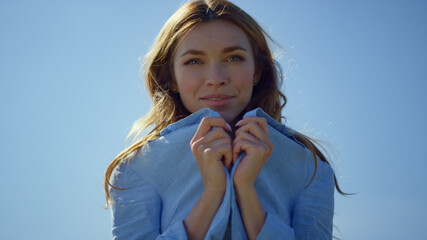 Wall Mural - Closeup happy woman wearing shirt. Pretty girl feeling comfortable in summer day