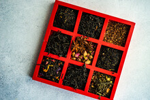 Overhead View Of A Box Of Assorted Loose Leaf Teas On A Table