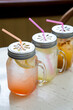 Three mason jars with fresh ice cold lemonade drink