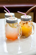 Three mason jars with fresh ice cold lemonade drink