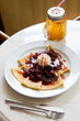 Freshly baked pancakes crepe served with berries