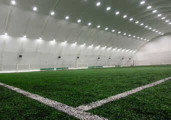 Football arena, with artificial grass, with copy space.