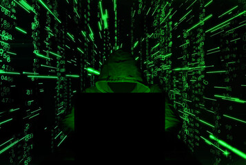 Hacker. Hacker attack. Developer. Software developer. Bandit. Criminal. Attack. information attack. Information. Cryptocurrency. Bitcoin. Computer. Green hacker. Darkness. Darknet. Masked man. Mask.