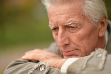 Sticker - Sad senior man posing in autumn park