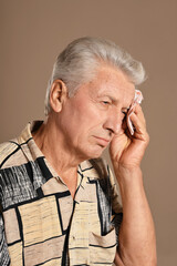 Sticker - Portrait of sad sick senior man with  headache