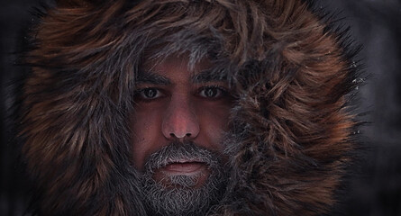 portrait of an adult man's face in severe weather conditions at extremely low temperatures