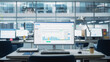 © Gorodenkoff - Desktop Computer Monitor with Finance Statistical Data Software and Progressive User Interface Standing on the Desk in the Modern Business Office. In the Background Glass Wall with Big City Office.