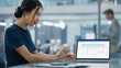 © Gorodenkoff - Multiethnic Office Meeting Room: Creative Asian Entrepreneur Female Use Laptop and Pointing on Screen with Financial Plan, Charts, Data.