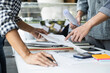 © Freedomz - Architecture Engineer Teamwork Meeting, Drawing and working for architectural project and engineering tools on workplace, concept of worksite on technical drawing structure and construction