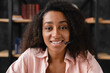 Tutoring. Customer support IT support manager. Cropped closeup of African young woman, receptionist talking online using headset looking at camera. Videocall conference conversation