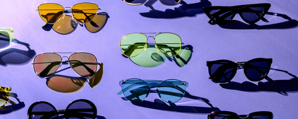 Poster - Variety of sunglasses over colorful background	