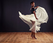 © Mapodile M/peopleimages.com - Freedom of movement. Young female contemporary dancer using a soft white white skirt for dramatic effect.