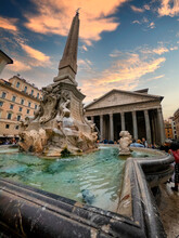 The Fountain Of Pantheon With Pantheon Church In Background, In Rome, Italy.