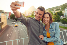 Sentimental Selfies. Shot Of A Happy Young Couple Taking A Selfie Together In The City.