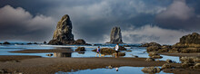 Canon Beach, Oregon - 9-4-2021: A Man And His Daughter And Their Dog Exploring Tide Pools At Low Tide On The Beach At Canon Beach, In Front Of The Needles (sea Stacks), On The North Oregon Coast