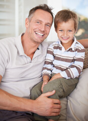 Wall Mural - Sharing some father son time. Portrait of a father and son sitting together.