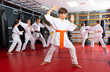 © JackF - Portrait of school child boy wearing in kimono, practicing new moves during karate class