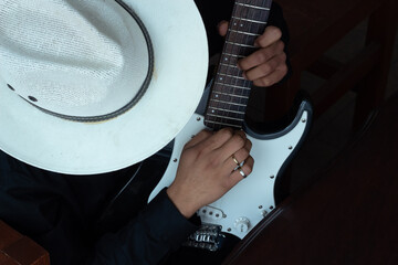 elegant guitarist playing his electric guitar