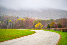 Farm Curve Dirt Road Picket Fence In Rural Virginia Near Blue Ridge Parkway Mountains In Autumn Fall Foliage Season With Idyllic Landscape Countryside, Yellow Leaf Color