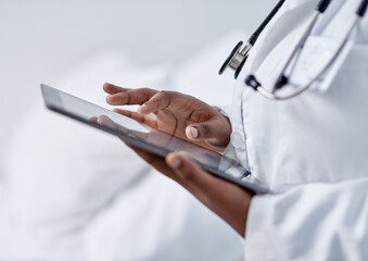 Wall Mural - advancing her skills through digital tech. closeup shot of an unrecognisable doctor using a digital 