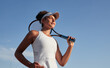 © kegfire - Black sportswoman with tennis racket against sky