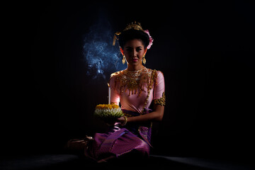 Wall Mural - Loykrathong Dress of Thai Traditional Costume or South East Asia gold Dress in Asian Woman