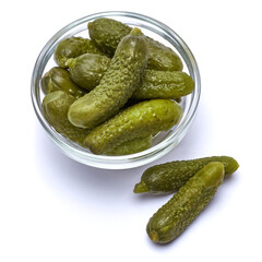 Wall Mural - Bowl of Tasty canned Whole green cornichons isolated on a white background