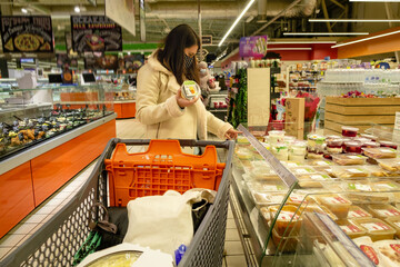 Wall Mural - woman in store choosing product