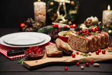 Traditional French Terrine Covered With Bacon On Dark Wooden Background With Christmas Decorations