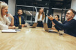 © Jacob Lund - Diverse businesspeople having a meeting in an office