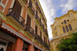 Historic ancient old town Malaga, Spain with picturesque and beautiful alleys, backstreets, building facades and cathedral as well as public parks with palm trees