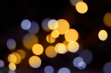Wall Mural - defocused lights on black background