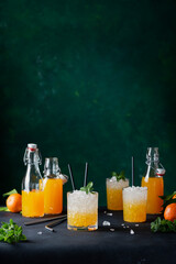 Poster - cocktail with fresh mandarins, crushed ice and mint leaves