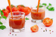 Glasses of fresh tomato juice with tomatoes.