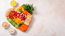 Colorful Vegan Charcuterie Board With Raw Vegetables And Whole Wheat Snacks