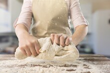 Beautiful And Strong Hands Knead The Dough Make Bread, Pasta Or Pizza.
