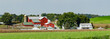 Amish Farm Setting with a Red Barn and Green Fields in Ohio's Amish Country