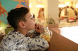 © Arkady Chubykin - Child has lemonade with ice at bar