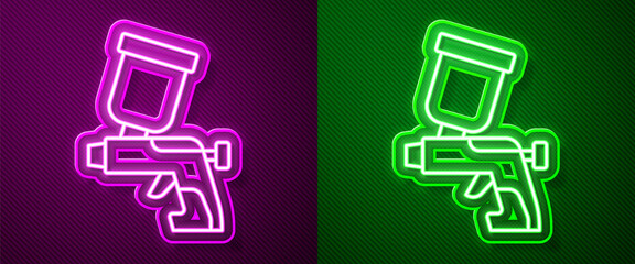 Canvas Print - Glowing neon line Paint spray gun icon isolated on purple and green background. Vector