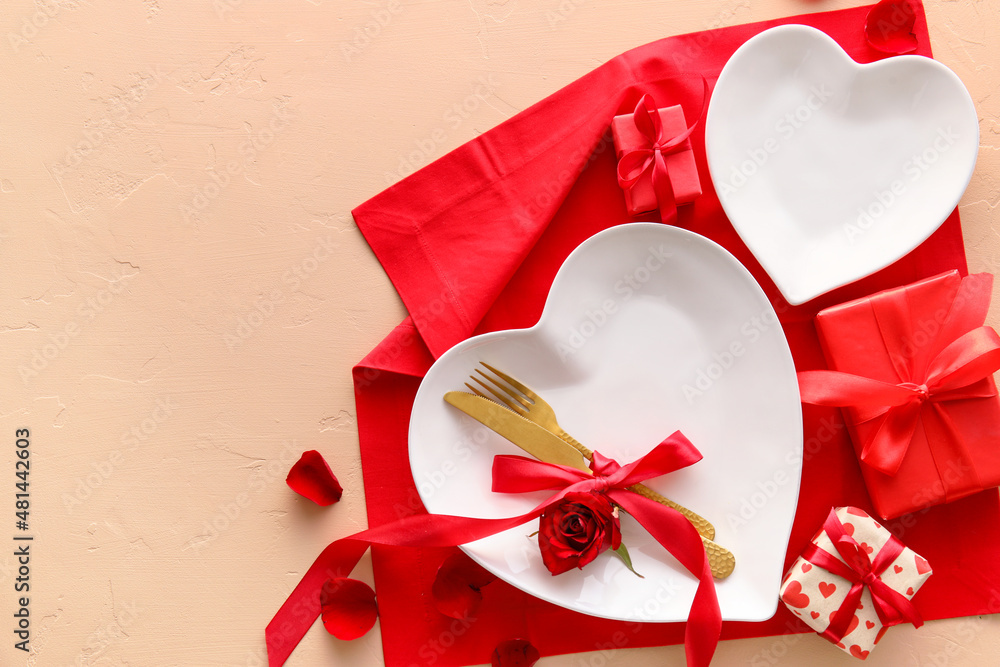Beautiful table setting for Valentine's Day and gift boxes  on beige background