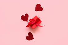 Beautiful Gift Box And Red Hearts On Pink Background. St. Valentine's Day