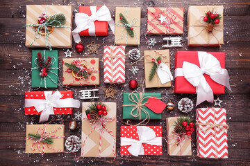 Canvas Print - Gift box with ornaments on brown wooden background