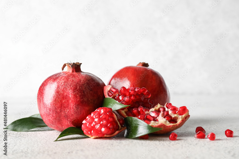 Ripe delicious pomegranate on light background