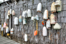 Lobster Buoys Of Various Color On Shack
