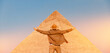 Man tourist walks background of pyramids in Giza Cairo Egypt, sun light travel banner