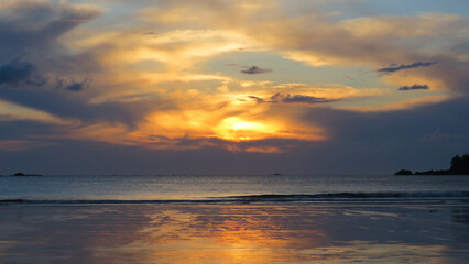 Wall Mural - Colorful sunset at the Northern Pacific beach