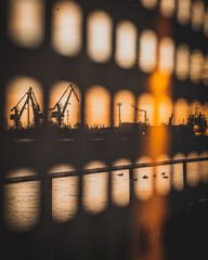 Amazing view of the shipyard in Gdansk during the sunset. View from Nowy Port. A bit of abstraction. Vertical view.