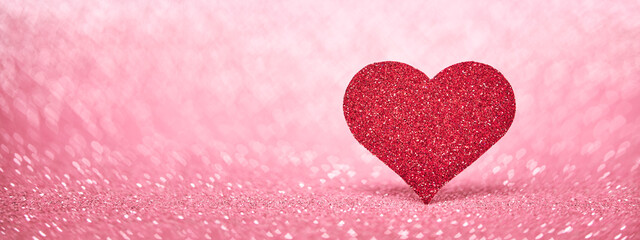 Wall Mural - Valentine's Day web banner with red heart, love symbol on pink sparkle background.