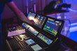 View of lighting technician operator working on mixing console workplace during live event concert on stage show broadcast, light mixer controller panel, sound technician with professional equipment