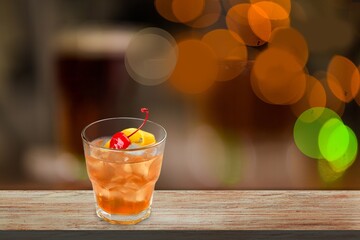 Poster - Glass of alcohol whiskey on the bar counter. Blurred interior of bar at the background.